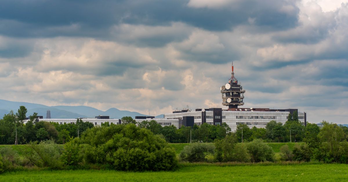 Scenic view of Zagreb's public media headquarters under a cloudy sky.